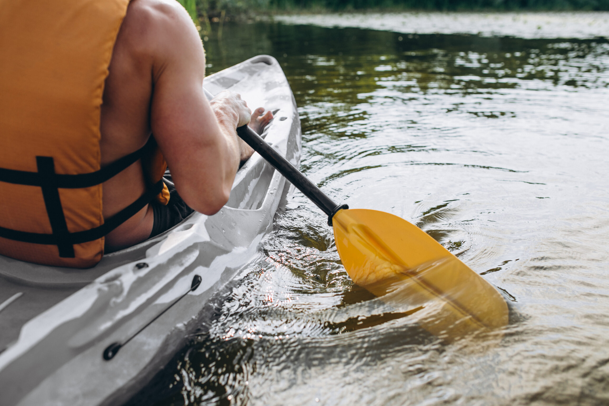 Young man kayaking on the river by Thrill Spirit